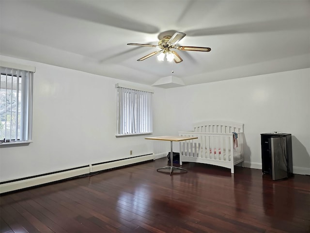 154-70 11th Ave, Whitestone, NY 11357 - unfurnished bedroom featuring hardwood / wood-style flooring, baseboards, a baseboard heating unit, and a ceiling fan