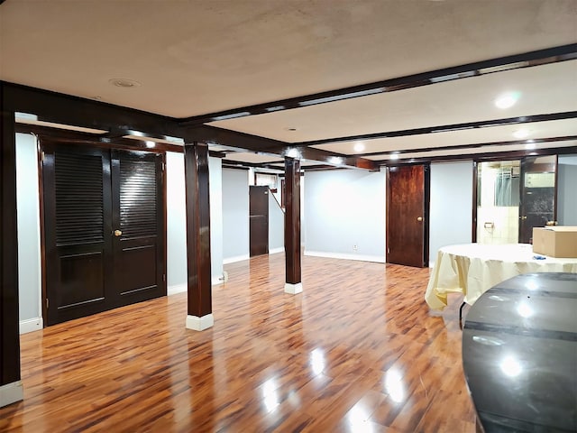 154-70 11th Ave, Whitestone, NY 11357 - finished below grade area featuring wood finished floors, baseboards, and recessed lighting