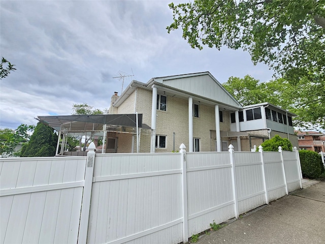 154-70 11th Ave, Whitestone, NY 11357 - view of side of property with brick siding and a chimney