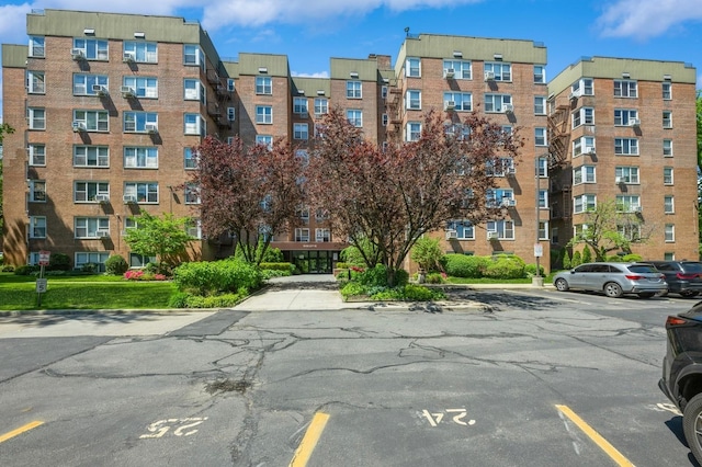 18-50 211th St Unit 2D, Bayside, NY 11360 - view of apartment building / complex featuring uncovered parking