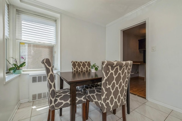 18-50 211th St Unit 2D, Bayside, NY 11360 - dining area with radiator heating unit, baseboards, ornamental molding, and light tile patterned floors