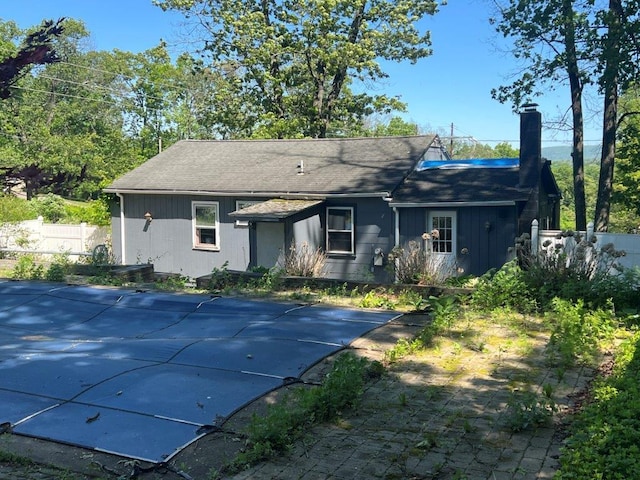 29 Purse Ln, Fishkill, NY 12533 - rear view of property featuring a chimney and a shingled roof