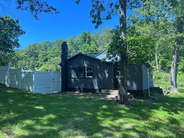 29 Purse Ln, Fishkill, NY 12533 - rear view of property with a chimney and a gate