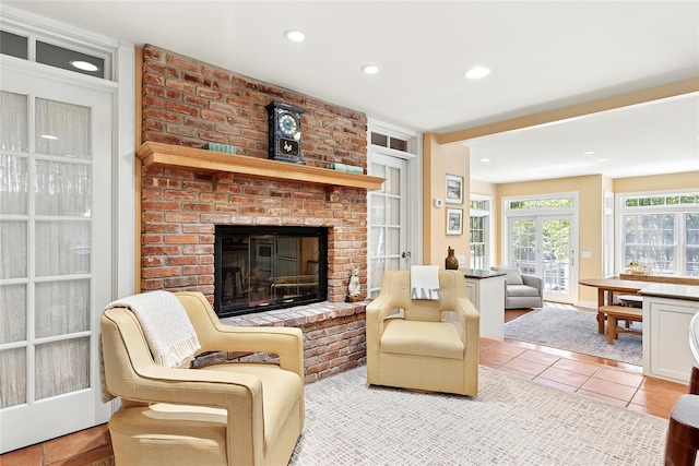 910 New Suffolk Ave, Mattituck, NY 11952 - living area featuring a fireplace, recessed lighting, and light tile patterned floors