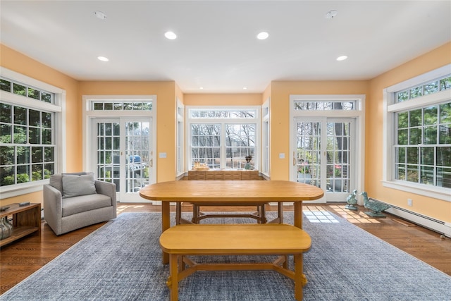 910 New Suffolk Ave, Mattituck, NY 11952 - dining room featuring recessed lighting, wood finished floors, and a baseboard heating unit