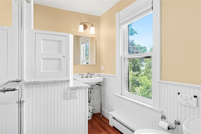 910 New Suffolk Ave, Mattituck, NY 11952 - bathroom featuring wainscoting, plenty of natural light, baseboard heating, and toilet