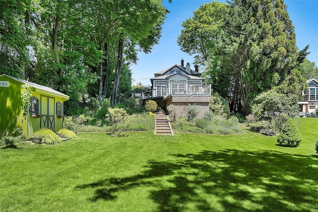 910 New Suffolk Ave, Mattituck, NY 11952 - view of green lawn featuring stairs, a wooden deck, and an outdoor structure