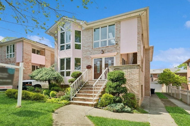 200-15 16th Ave, Bayside, NY 11360 - view of front of house with brick siding and french doors