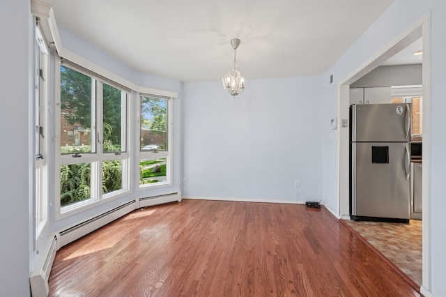 200-15 16th Ave, Bayside, NY 11360 - unfurnished dining area with light wood finished floors, a chandelier, baseboards, and a baseboard radiator
