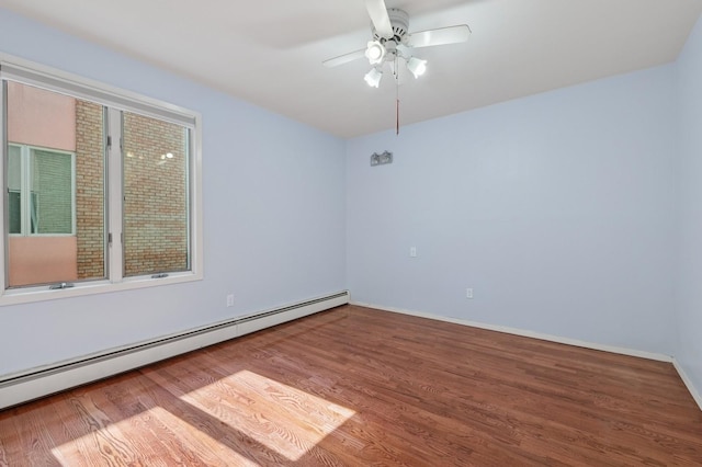 200-15 16th Ave, Bayside, NY 11360 - spare room with baseboard heating, wood finished floors, a ceiling fan, and baseboards