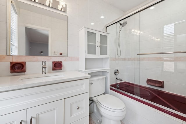 200-15 16th Ave, Bayside, NY 11360 - bathroom featuring vanity, tiled shower / bath combo, toilet, and tile walls