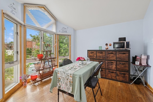 200-15 16th Ave, Bayside, NY 11360 - dining area with healthy amount of natural light, lofted ceiling, and wood finished floors