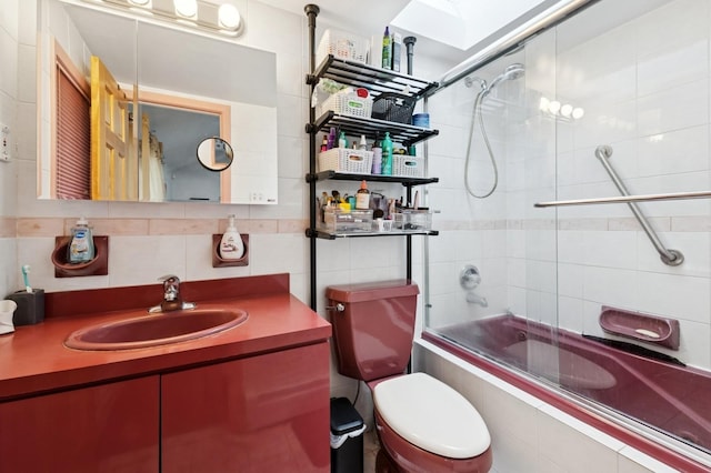 200-15 16th Ave, Bayside, NY 11360 - full bathroom featuring toilet, tiled shower / bath combo, a skylight, vanity, and tile walls