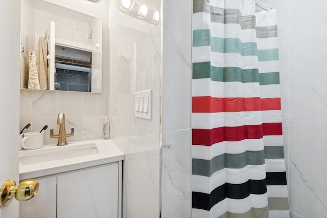 200-15 16th Ave, Bayside, NY 11360 - full bath with tile walls, vanity, curtained shower, and decorative backsplash