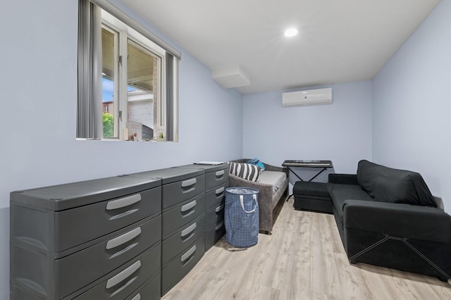 200-15 16th Ave, Bayside, NY 11360 - sitting room featuring a wall mounted air conditioner and light wood-style flooring