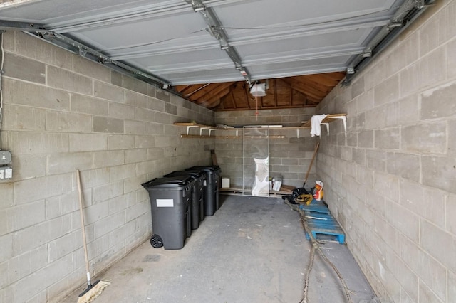 200-15 16th Ave, Bayside, NY 11360 - garage with a garage door opener and concrete block wall