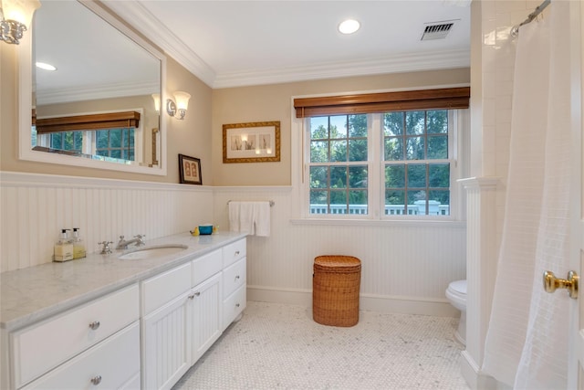 4 Pond Ln, Sands Point, NY 11050 - full bath featuring wainscoting, vanity, toilet, ornamental molding, and baseboards