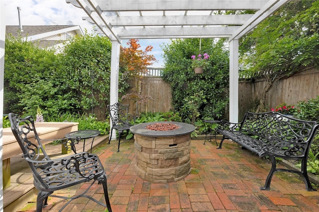 26 Adams Ave, Bayville, NY 11709 - fenced backyard with a fire pit, a pergola, and a patio