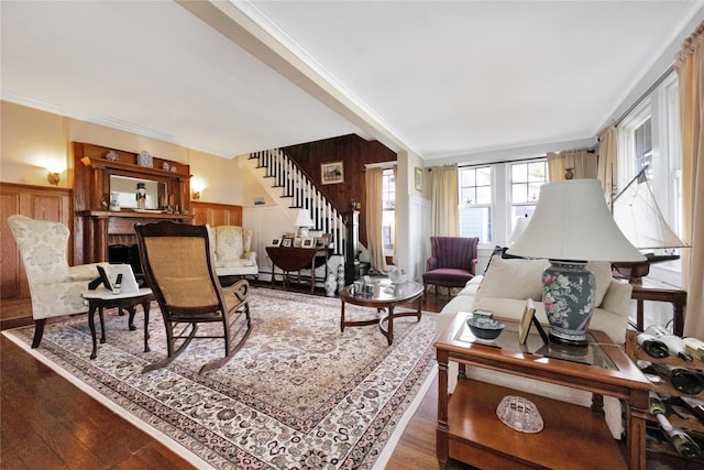 26 Adams Ave, Bayville, NY 11709 - living area with stairway, wood finished floors, wainscoting, crown molding, and wooden walls