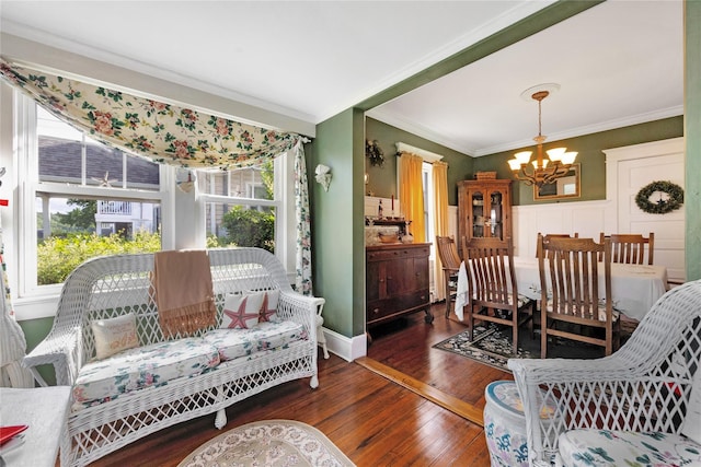26 Adams Ave, Bayville, NY 11709 - living area with a chandelier, ornamental molding, plenty of natural light, and hardwood / wood-style floors