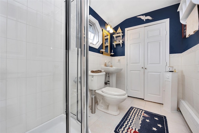26 Adams Ave, Bayville, NY 11709 - bathroom with tile walls, a shower stall, tile patterned floors, toilet, and lofted ceiling