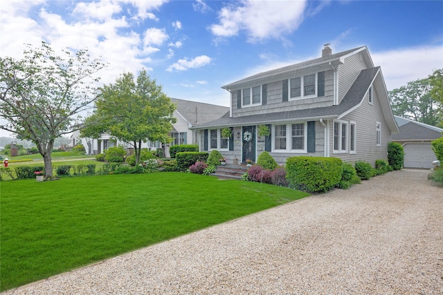 26 Adams Ave, Bayville, NY 11709 - view of front of house with a chimney, a front yard, roof with shingles, driveway, and an outdoor structure