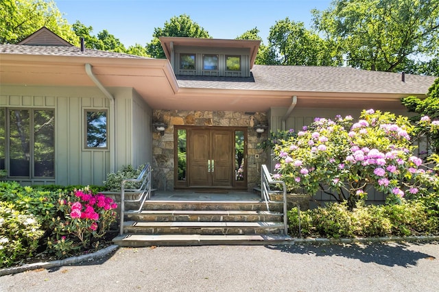 1 Polly Pk Rd, Rye, NY 10580 - property entrance featuring board and batten siding, a shingled roof, a porch, and stone siding