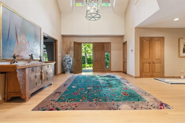 1 Polly Pk Rd, Rye, NY 10580 - foyer featuring wood finished floors, a towering ceiling, and baseboards