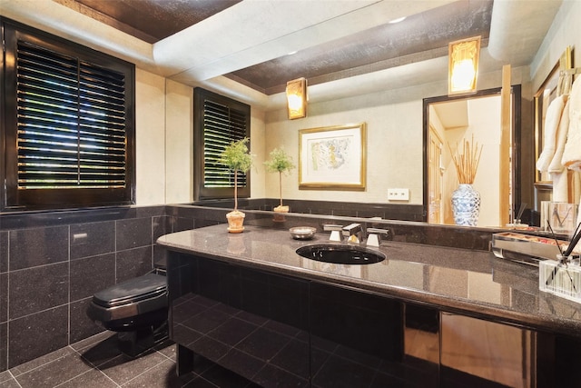 1 Polly Pk Rd, Rye, NY 10580 - bathroom with toilet, tile patterned floors, vanity, tile walls, and a raised ceiling