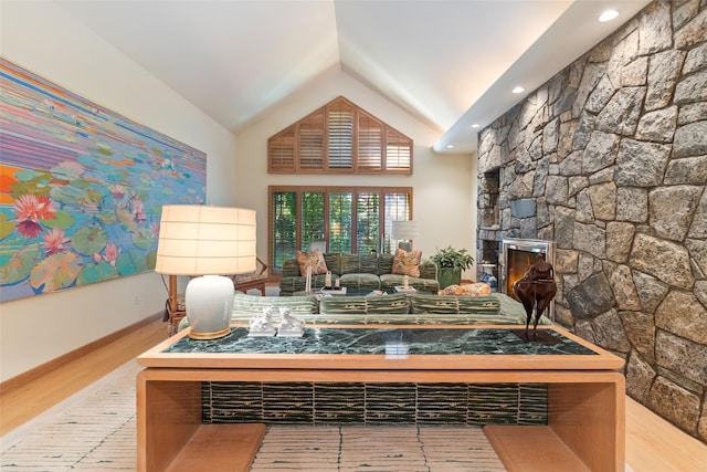 1 Polly Pk Rd, Rye, NY 10580 - living room featuring wood finished floors, vaulted ceiling, and a stone fireplace