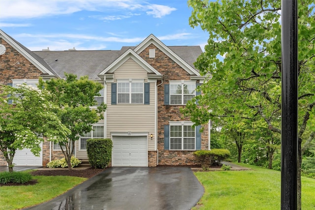 12 Webster Ct, Monroe, NY 10950 - view of front of property with driveway, stone siding, a front lawn, and an attached garage