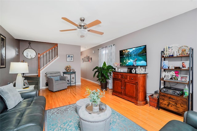 35 Futurity Pl, Staten Island, NY 10312 - living room featuring ceiling fan, light wood finished floors, stairs, and baseboards