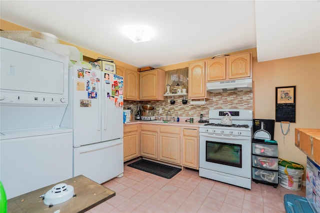 35 Futurity Pl, Staten Island, NY 10312 - kitchen with white appliances, under cabinet range hood, stacked washer and clothes dryer, and light brown cabinetry