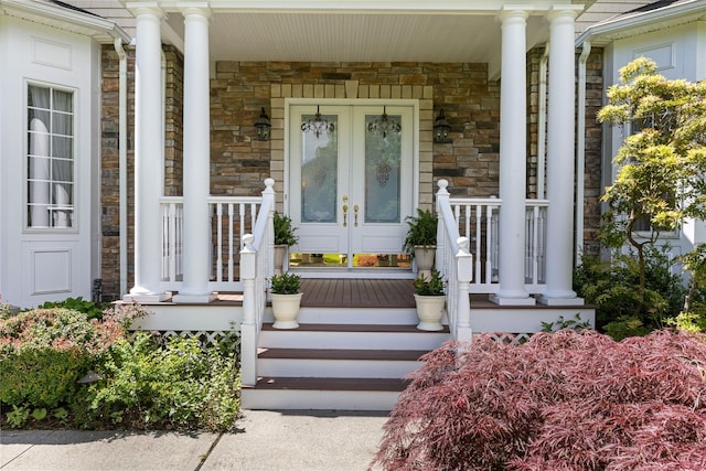 1 Majestic Rdg, Carmel, NY 10512 - view of exterior entry featuring covered porch, stone siding, and french doors
