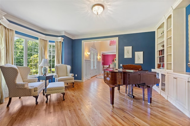 1 Majestic Rdg, Carmel, NY 10512 - sitting room featuring built in shelves, light wood finished floors, crown molding, and a wainscoted wall