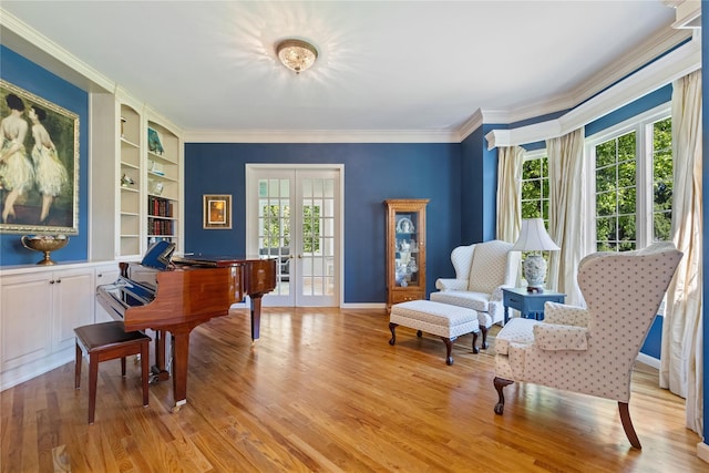 1 Majestic Rdg, Carmel, NY 10512 - living area with built in shelves, french doors, wood finished floors, ornamental molding, and baseboards
