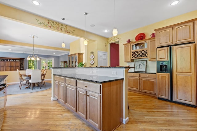 1 Majestic Rdg, Carmel, NY 10512 - kitchen with paneled refrigerator with ice dispenser, light wood-type flooring, dark stone counters, hanging light fixtures, and recessed lighting