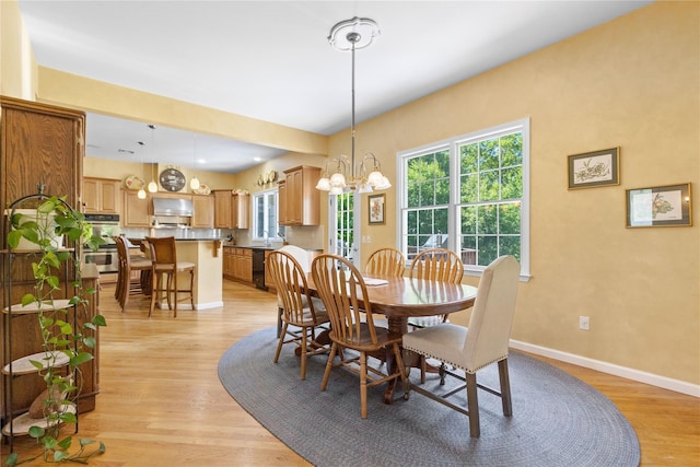1 Majestic Rdg, Carmel, NY 10512 - dining area featuring a chandelier, light wood-style floors, and baseboards