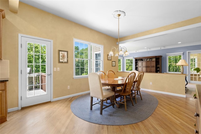 1 Majestic Rdg, Carmel, NY 10512 - dining room with baseboards, healthy amount of natural light, light wood-type flooring, and a chandelier