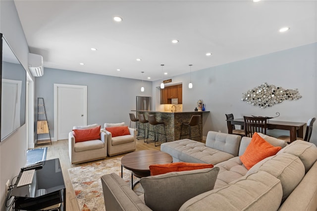 1 Majestic Rdg, Carmel, NY 10512 - living room featuring a wall mounted air conditioner, recessed lighting, wet bar, and light wood-style floors
