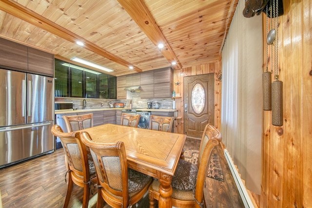 6 Medallion Rd, Kiamesha Lake, NY 12751 - dining space featuring light wood-style floors, wooden ceiling with exposed beams, and washer / clothes dryer
