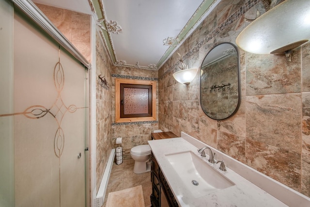 6 Medallion Rd, Kiamesha Lake, NY 12751 - bathroom with tile walls, vanity, toilet, and tile patterned floors