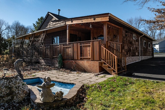 6 Medallion Rd, Kiamesha Lake, NY 12751 - back of house featuring an outdoor pool and a patio area