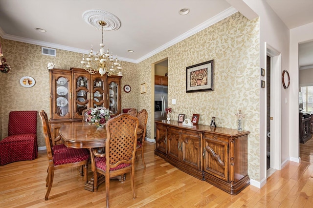5 Mantack Path, Kings Park, NY 11754 - dining space with wallpapered walls, a chandelier, light wood-style flooring, baseboards, and crown molding