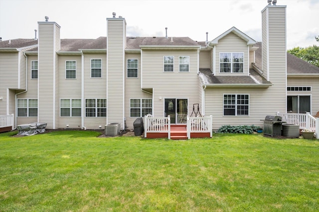 5 Mantack Path, Kings Park, NY 11754 - rear view of house featuring a chimney, a deck, a yard, and central AC