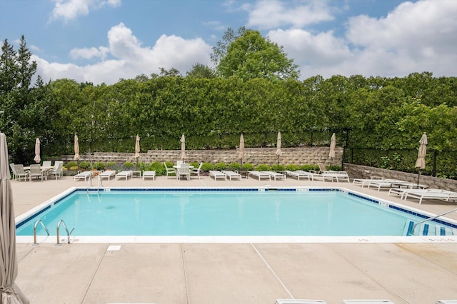 5 Mantack Path, Kings Park, NY 11754 - community pool featuring a patio and view of wooded area