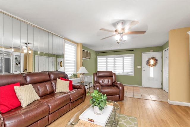 149-32 18th Ave, Whitestone, NY 11357 - living room with ceiling fan, a wall unit AC, wood finished floors, and baseboards