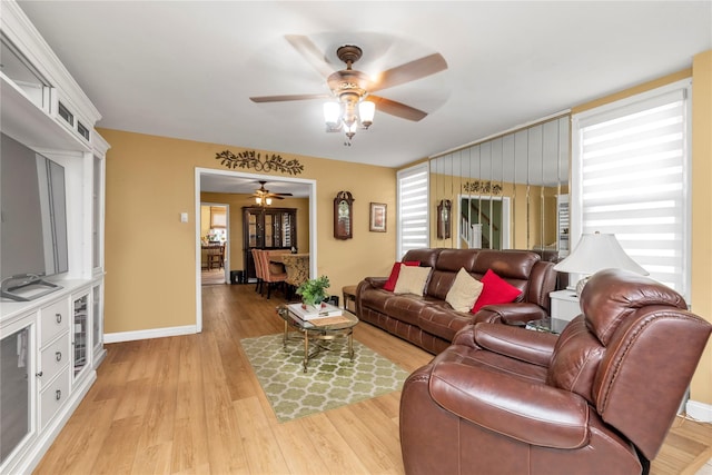 149-32 18th Ave, Whitestone, NY 11357 - living room with light wood-type flooring, a ceiling fan, beverage cooler, and baseboards
