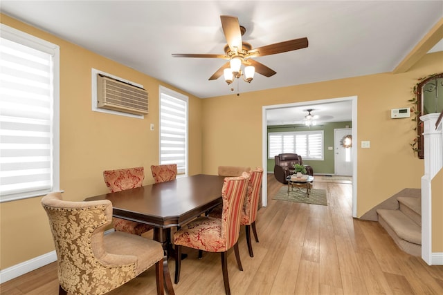 149-32 18th Ave, Whitestone, NY 11357 - dining space with plenty of natural light, a ceiling fan, light wood-style floors, and an AC wall unit