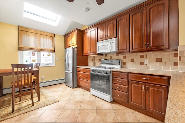 149-32 18th Ave, Whitestone, NY 11357 - kitchen featuring range with gas cooktop, stainless steel fridge, white microwave, a skylight, and backsplash